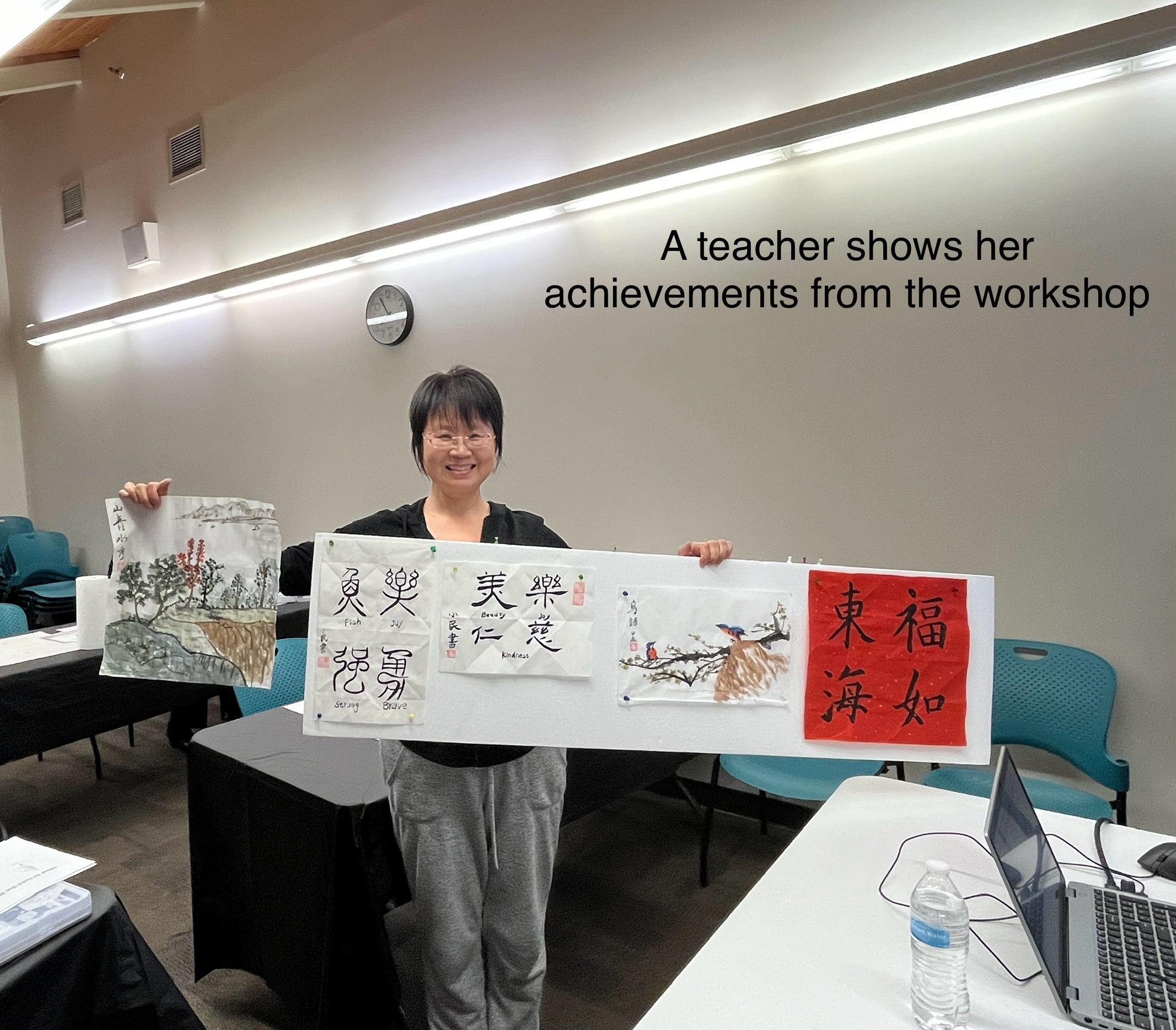 A student shows off her work from the class